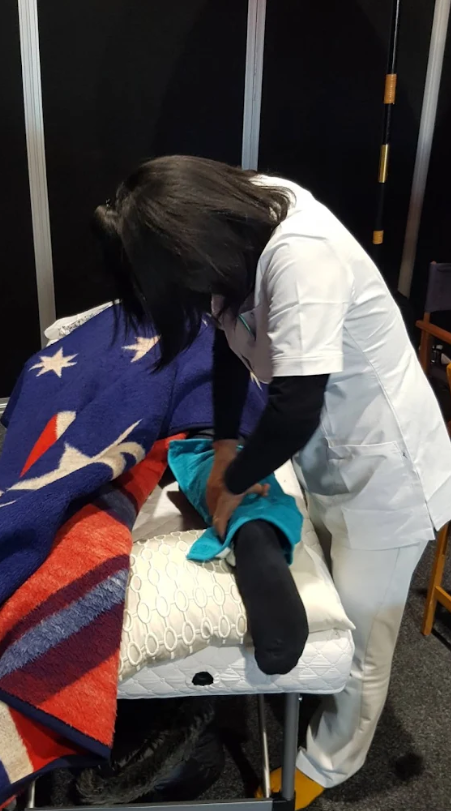 Kyoko performing massage therapy